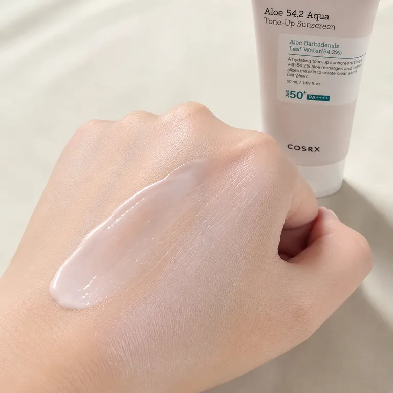 COSRX Aloe Tone-Up Sunscreen lightweight creamy texture swatched on skin