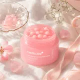 Medicube PDRN Pink Capsule Cream jar showing pink capsules in clear gel base