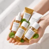 Skin1004 Madagascar Centella Travel Kit with centella leaves on marble