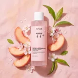 ANUA Peach 77 Toner with fresh peach slices and peach blossoms