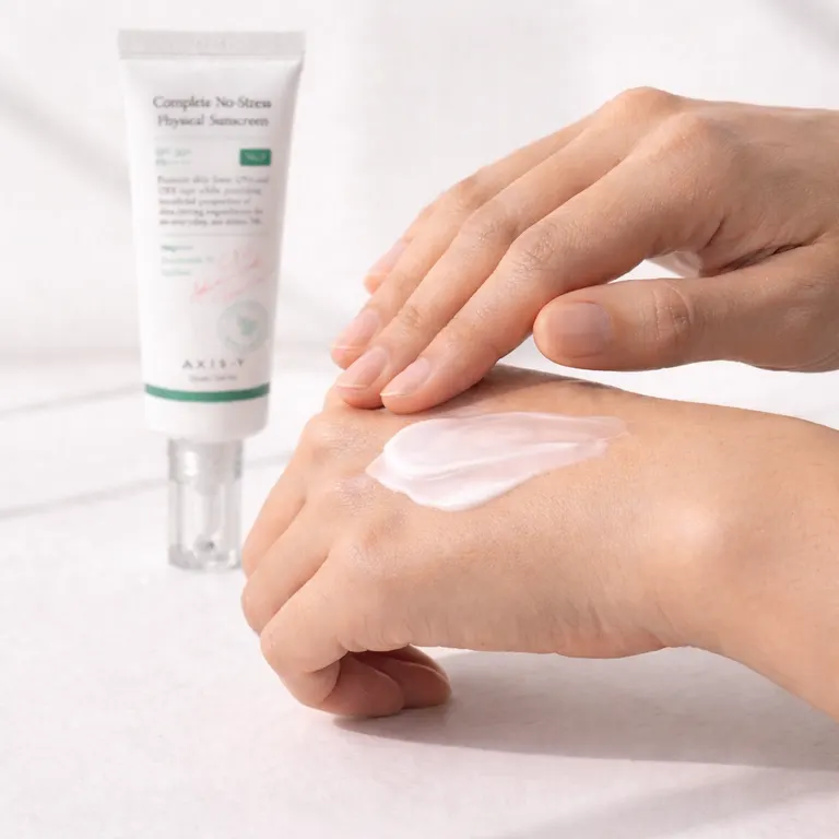 Applying AXIS-Y Physical Sunscreen on back of hand - no white cast mineral texture