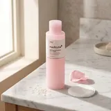 Medicube PDRN Pink Niacinamide Milky Toner on white marble vanity
