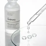 The Ordinary Niacinamide Zinc Serum clear droplets on glass surface