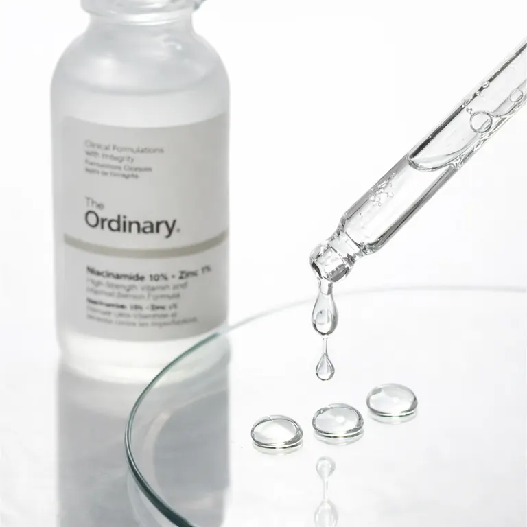 The Ordinary Niacinamide Zinc Serum clear droplets on glass surface