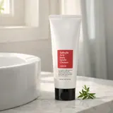 COSRX Salicylic Acid Daily Gentle Cleanser next to bathroom sink