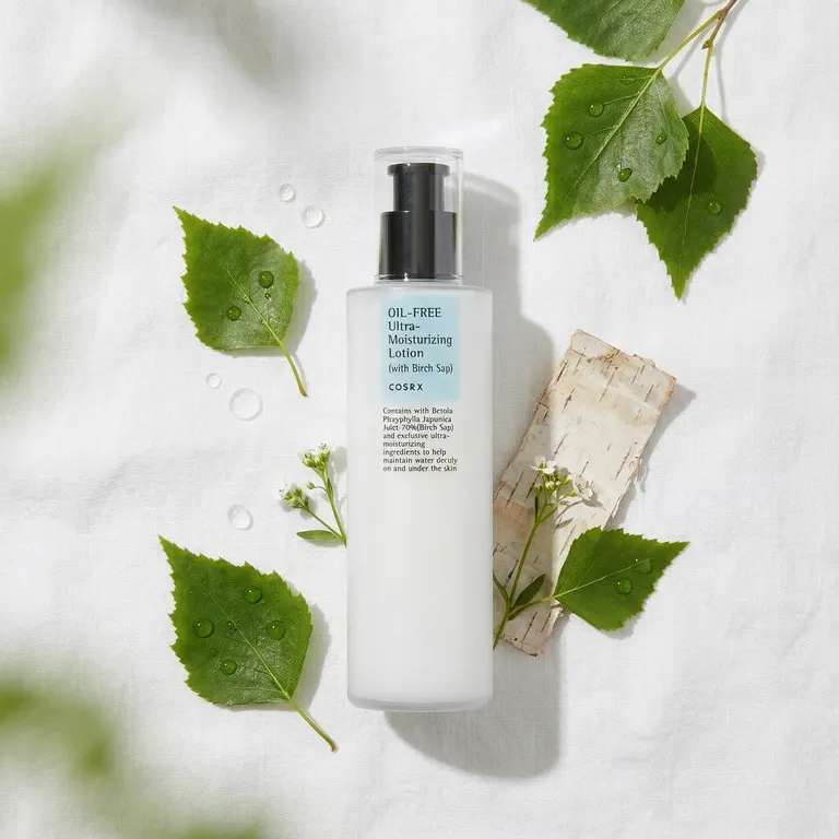 COSRX Birch Sap Lotion with birch leaves and water droplets