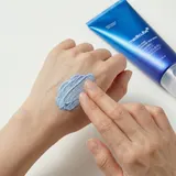 Applying Medicube Zero Pore Mud Mask on back of hand - clay texture