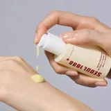 K-Secret Retinal Liposome Serum golden droplets on glass surface
