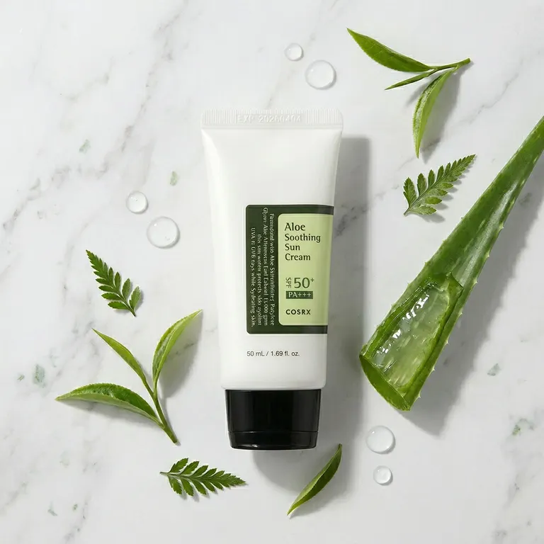 COSRX Aloe Sun Cream with fresh aloe vera leaves